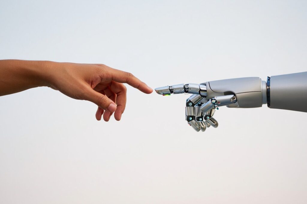 Hand reaching out to a robot hand